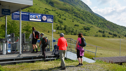 Access portal as a clock panel with Intersport Rent motif in the Galtür summer mountain region