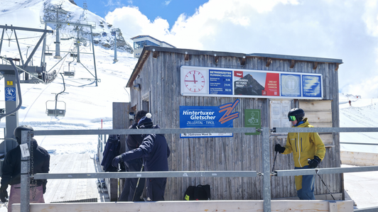 Clock board with Tirol Werbung summer theme at the valley station of the Gefrorene Wand T-bar lift in the Hintertux Glacier ski area