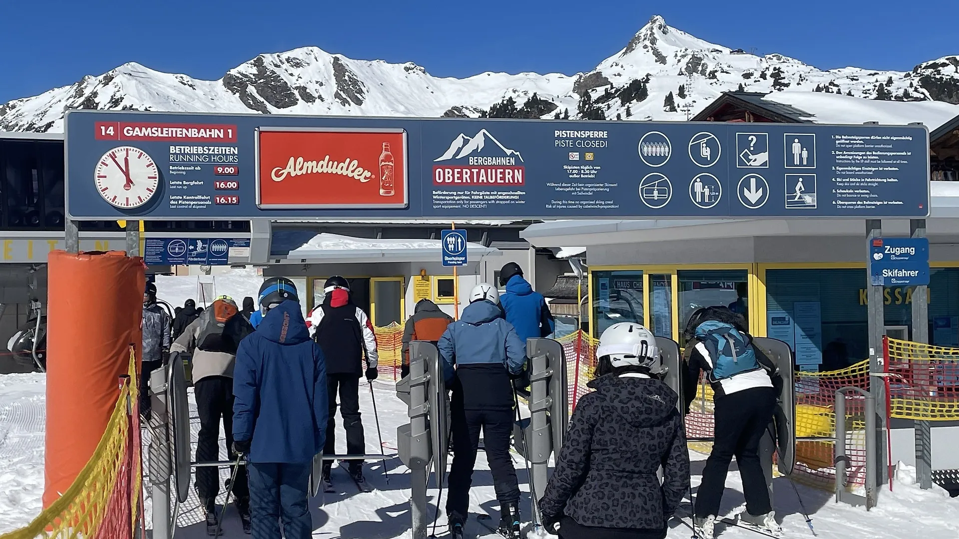 Access portal as a clock panel with Almdudler advertising space in the Obertauern ski area
