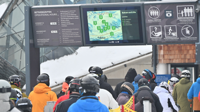 Digital signage banner system with LCD screen for information on cable cars and lifts at Ski Arlberg, St. Anton