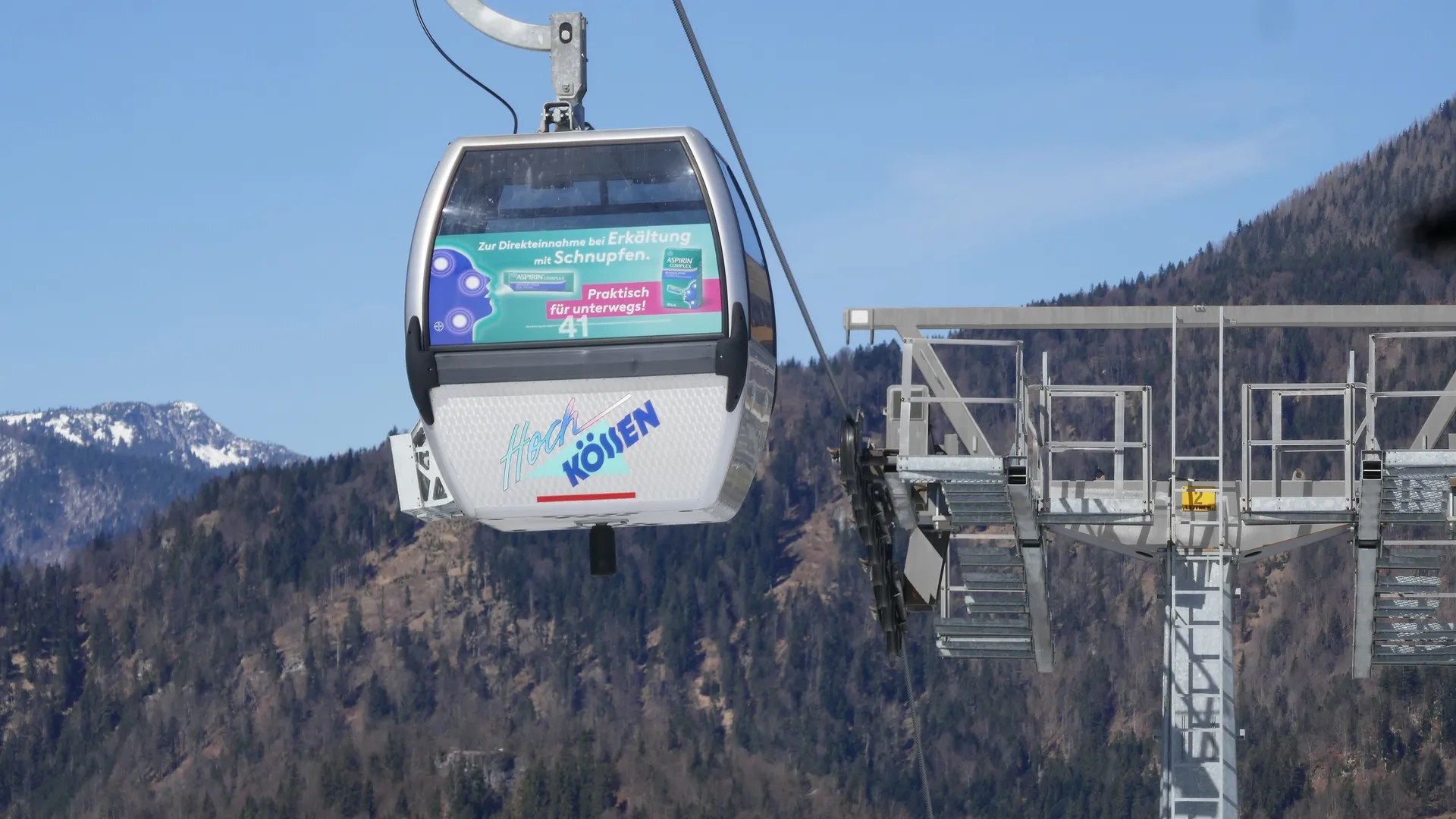 Gondolas with Aspirin advertising in the Hochkössen summer mountain region, Kössen