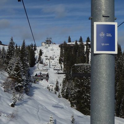 Ski lift pylon advertising with LGT motif in the KitzSki ski area, Kitzbühel